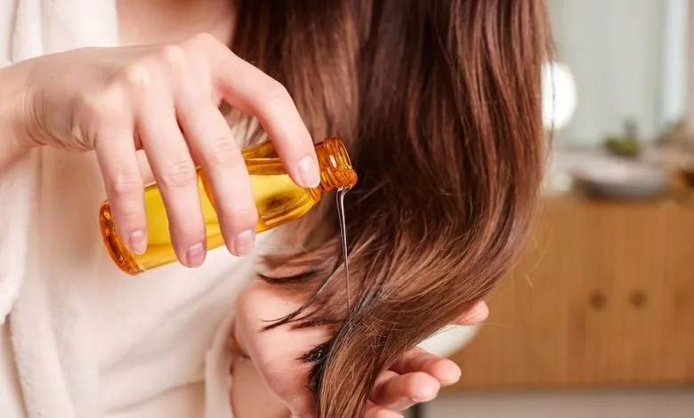 Woman Applying Hair Oil Modern B