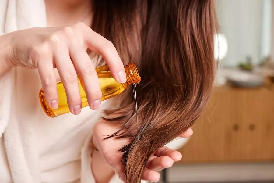 Woman Applying Hair Oil Modern B
